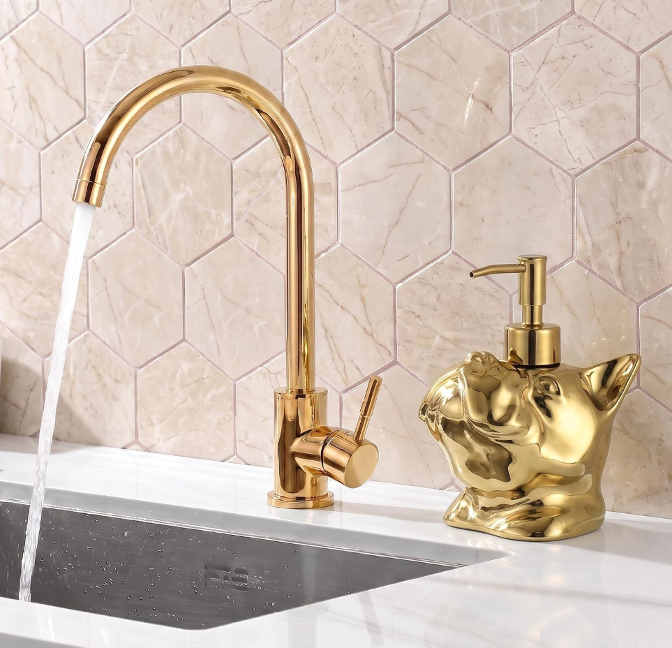Gold French bulldog soap dispenser by a sink