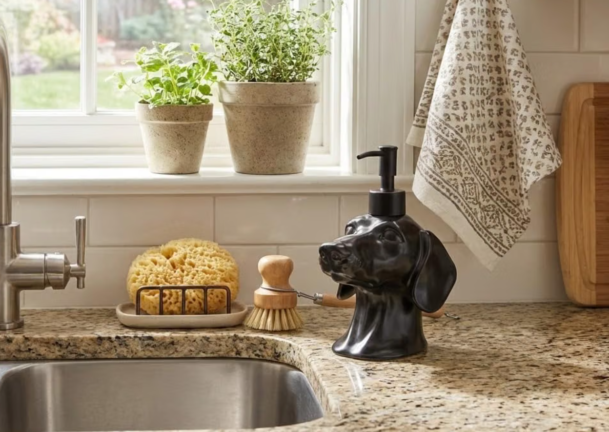 Black dachshund soap dispenser in a kitchen