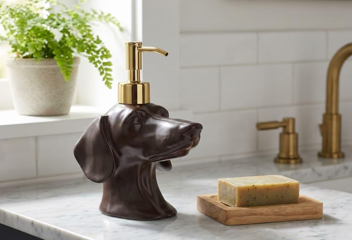Brown dachshund soap dispenser styled beside a bathroom sink